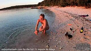 Hey, watch this pretty girl dance nude on the beach! 🔥