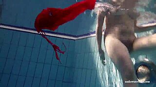 Russian teen Lucie dives naked for underwater pool swim