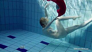 Russian teen Lucie dives naked for underwater pool swim