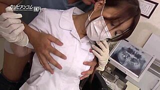 Beautiful Asian woman with great big natural breasts gets a blindfolded massage with oil with a dental massage