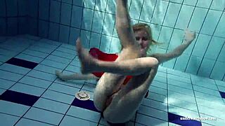 Russian teen Lucie dives naked for underwater pool swim
