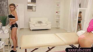 Asian beauty passionately fingers and kisses hot masseuse on the massage table.