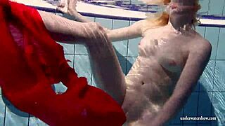 Russian teen Lucie dives naked for underwater pool swim