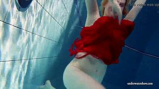 Russian teen Lucie dives naked for underwater pool swim