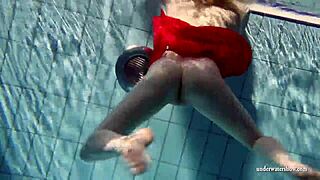 Russian teen Lucie dives naked for underwater pool swim