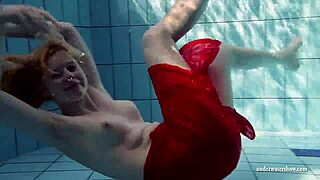 Russian teen Lucie dives naked for underwater pool swim