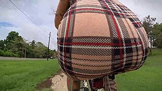 exhibitionist rides bike with butt plug, neighbor spies on tattooed ass.