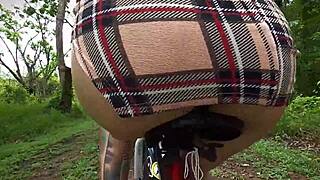 exhibitionist rides bike with butt plug, neighbor spies on tattooed ass.