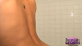 sexy brunette with short hair shaves her long legs in the shower