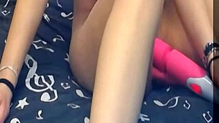 the girl is using two vibrating dildos on her pussy, it's so hot!