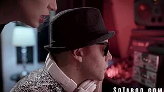 Striking a chord with the DJ for fame in this teen group scene.