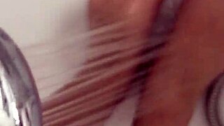 Hungarian babe takes off nylon and enjoys footjob in shower.