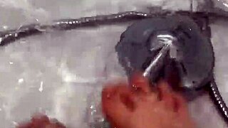 Hungarian babe takes off nylon and enjoys footjob in shower.