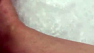 Hungarian babe takes off nylon and enjoys footjob in shower.