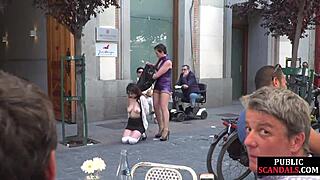 Busty Slut Submits Publicly in Heels. Voyeurs Crowd Around.