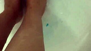 Hungarian babe takes off nylon and enjoys footjob in shower.