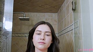 sexy brunette model freshens up with a steamy shower session