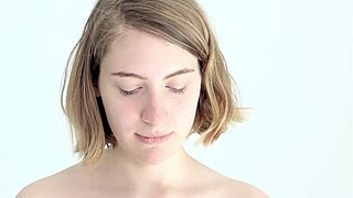 A young babe experiences blowing and popping her first balloon