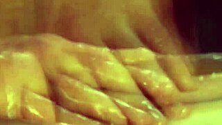 Enjoying an erotic gay massage session on the table