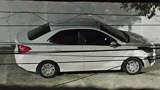 She meets her lover in the car in front of the house and returns smiling