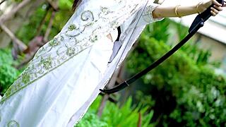 indian warrior in costume gets bent over outdoors