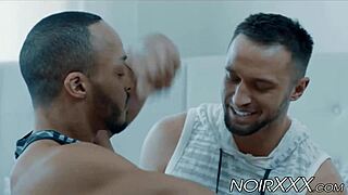 In this interracial scene, muscular bodybuilders engage in rimming and anal activities together