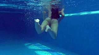 Kittina Ivory undresses her juicy tits and pussy in the public swimming pool.