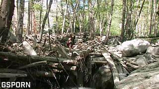 Sexy natural 18-year-old girl touches her hairy pussy deep in the forest for intense pleasure.