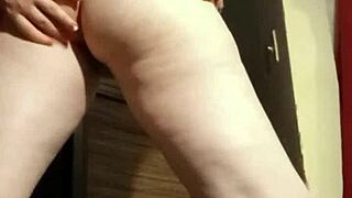 Busty camgirl fingers her ass.