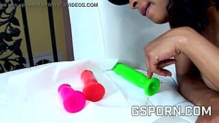 Ebony lesbians insert butt plugs in asses and dildos in pussies