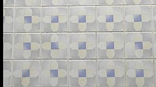 Hidden camera captures mature woman's emotional bathroom moment