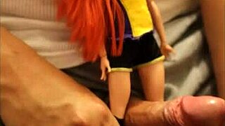 Redhead Batgirl doll tied up in blowbang, receiving footjob and bukkake cumshot from POV