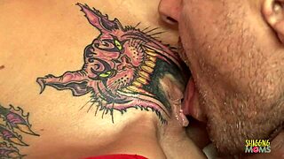 skinny blonde with pussy tattoo takes creampie on red couch. she rides hard in cowgirl style.