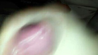 Detailed handjob session with masturbation leading to intense cumshot on amateurs