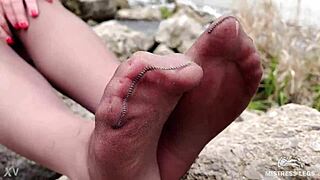 goddess teases with feet in forest