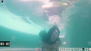 Helen Star and her partner explore underwater submission with toys.