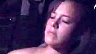 Busty milf masturbates in car.