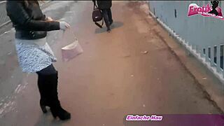 german brunette pisses into handbag outdoors