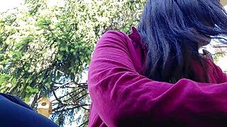 nicoletta is smoking in the public garden and flashing her big tits by pulling them out