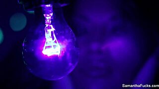 Samantha Saint enjoys lesbian sex under black light with big tits