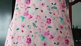 Model in sexy pink pajamas with innocent colleague