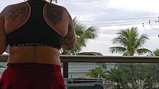 girl flashes her ass on the balcony in skirt
