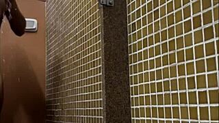 Brazilian spy in the gym shower sees a huge dick.
