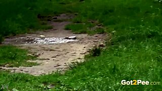 Hot Susan Ayn, dang, peein’ in public. Brunette relievin’ herself outdoors like crazy.