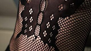 Hot milf in fishnets looks sexy