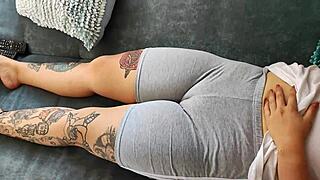 Latina milf touches tight vagina through leggings.