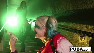 Poison Ivy playfully sticks a bat up Harley's ass during their nude lesbian sex, with big tits and redhead pornstars involved in the wild fucking.