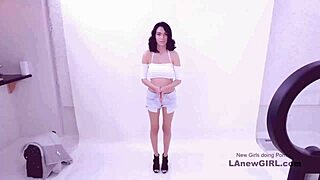 shy brunette model goes through a modeling audition on the sofa