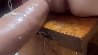 experimenting with huge dildos on the machine at home