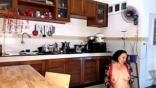 Housewife in pantyhose reaches orgasm while cooking in the kitchen